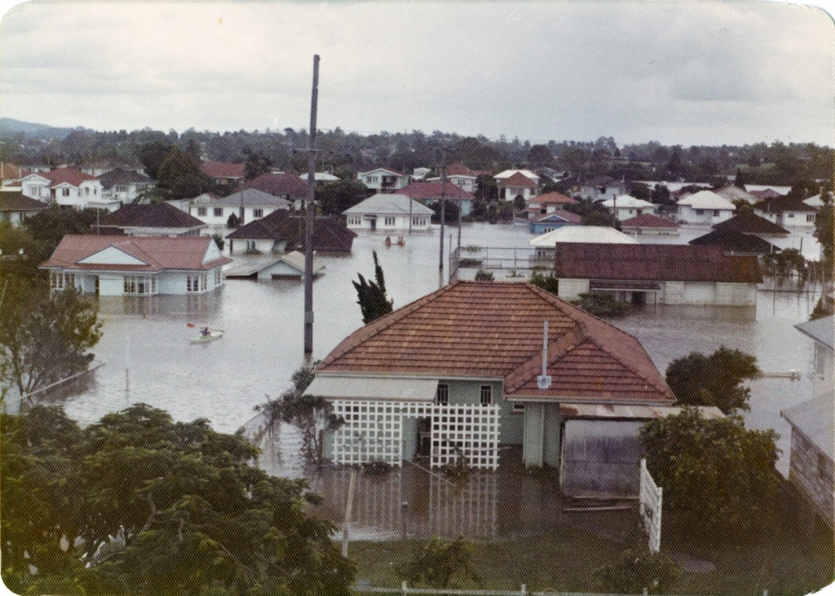 View of Erroll Street with house partial submerged in floodwater during the 1974 flood in Graceville, Queensland