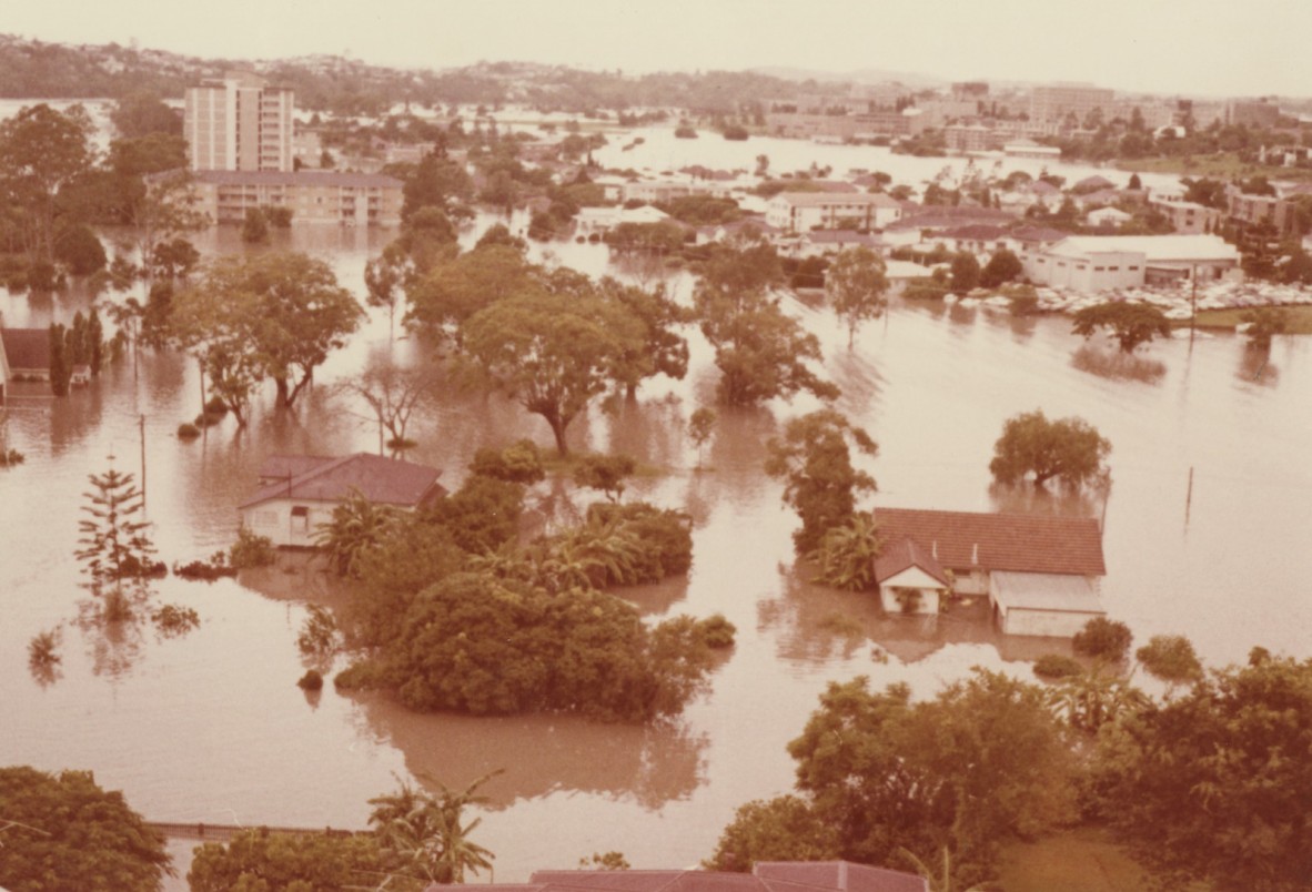 Aerial view of flooded houses and unit block St. Lucia, Queensland during the 1974 Flood