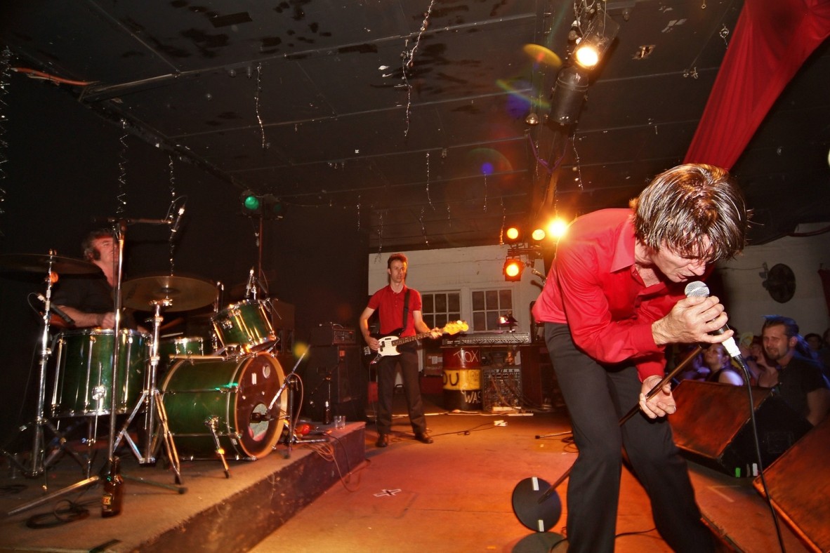 A 3 piece band perform on stage at The Zoo nightclub in Fortitude Valley, Brisbane