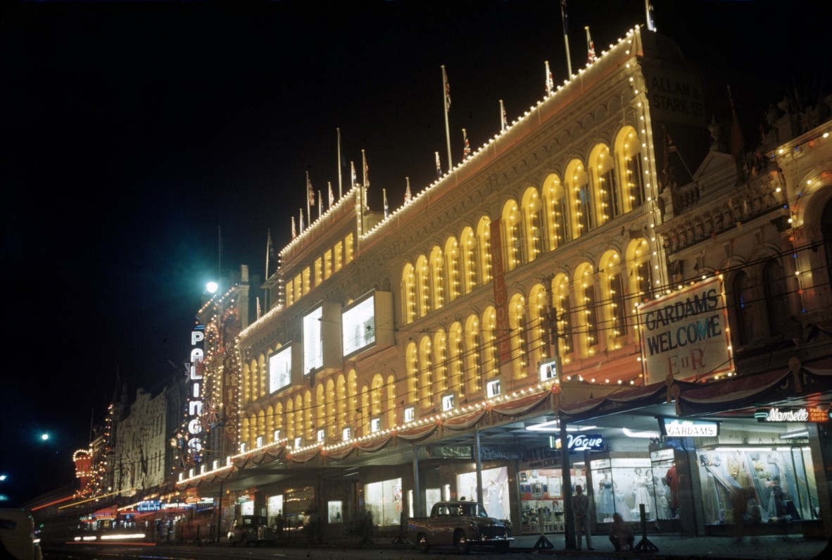 Colour photograph of a section of Queen Street with the buildings illuminated by lights