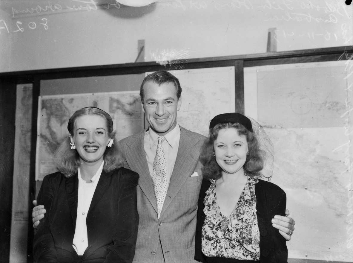 Una Merkel (right) and actress Phyllis Brooks (left) with Gary Cooper. 