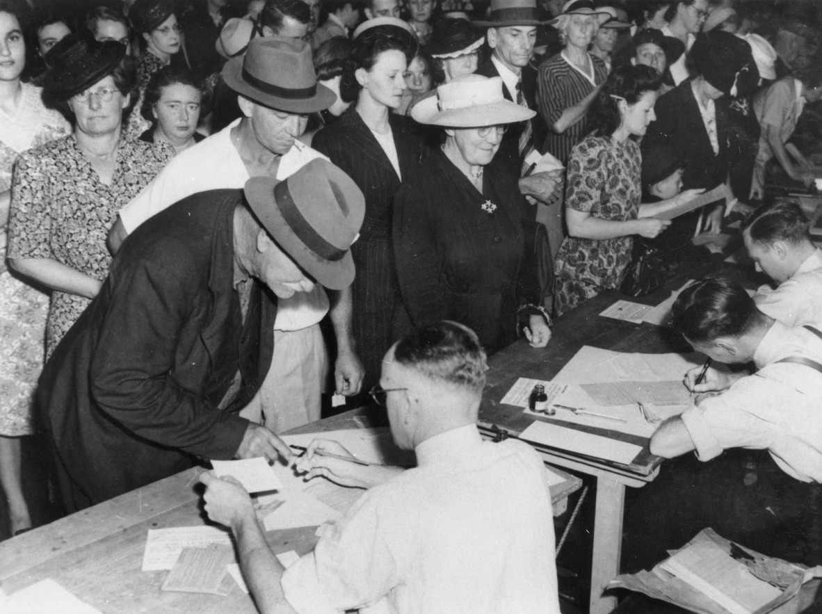 Crowd queuing for rationing cards