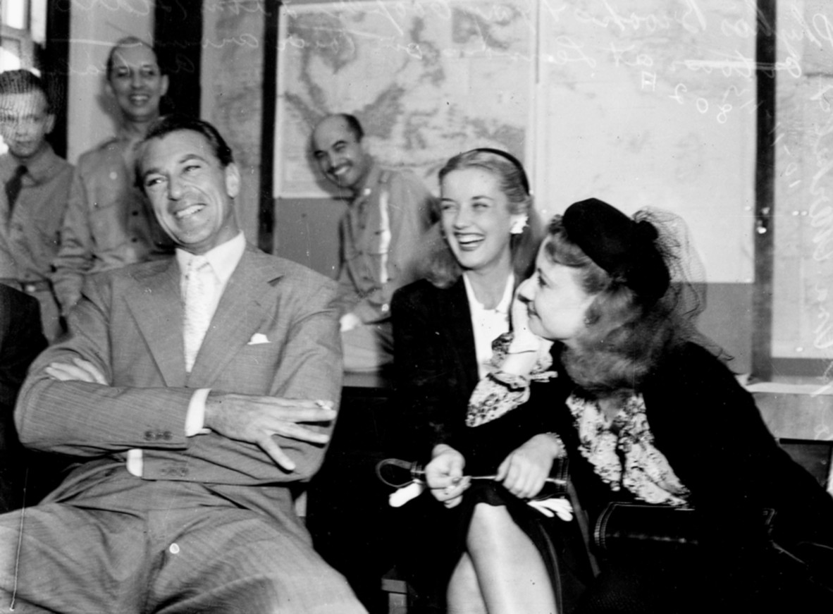 Film stars Gary Cooper, Phyllis Brooks and Una Merkel in Brisbane at a press conference, 8 November, 1943. 