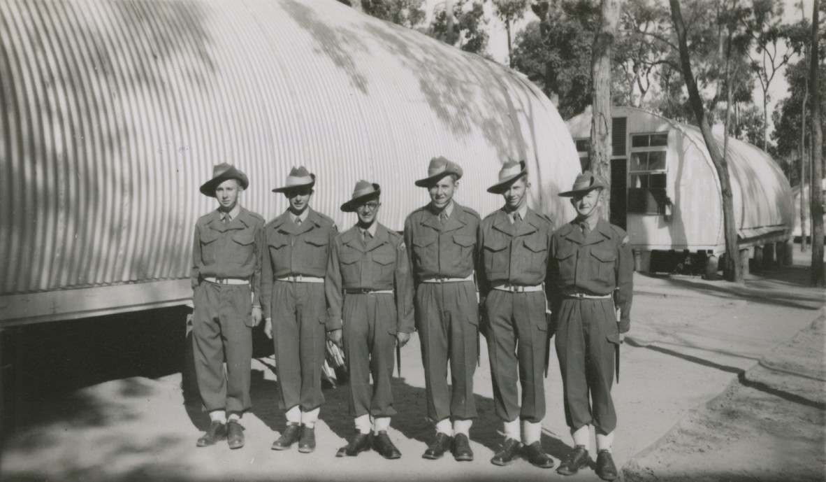 Six National Servicemen from 2nd platoon A Company, 11 National Service Training Battalion, standing in front of their platoon hut at Wacol, 1953
