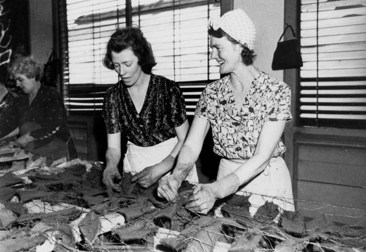 Volunteers working on camouflage nets