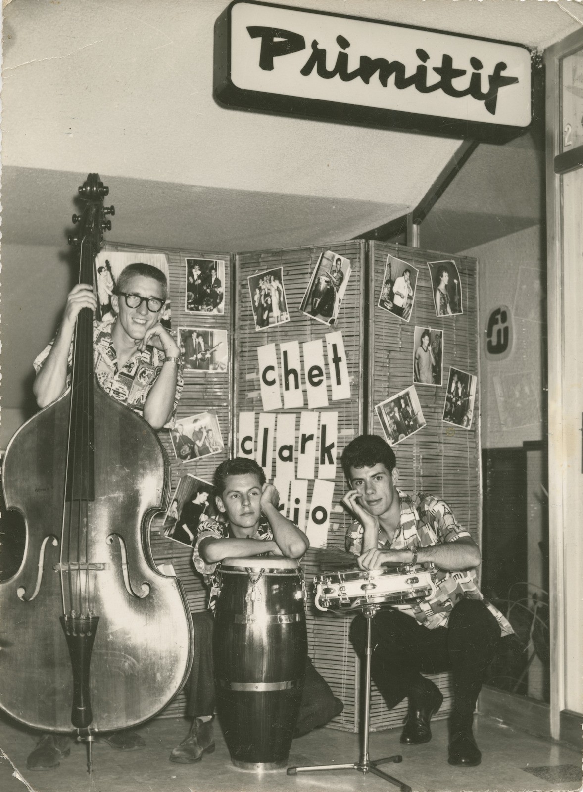 Chet Clark Trio posing with their musical instruments on stage at the Primitif Cafe in Brisbane 