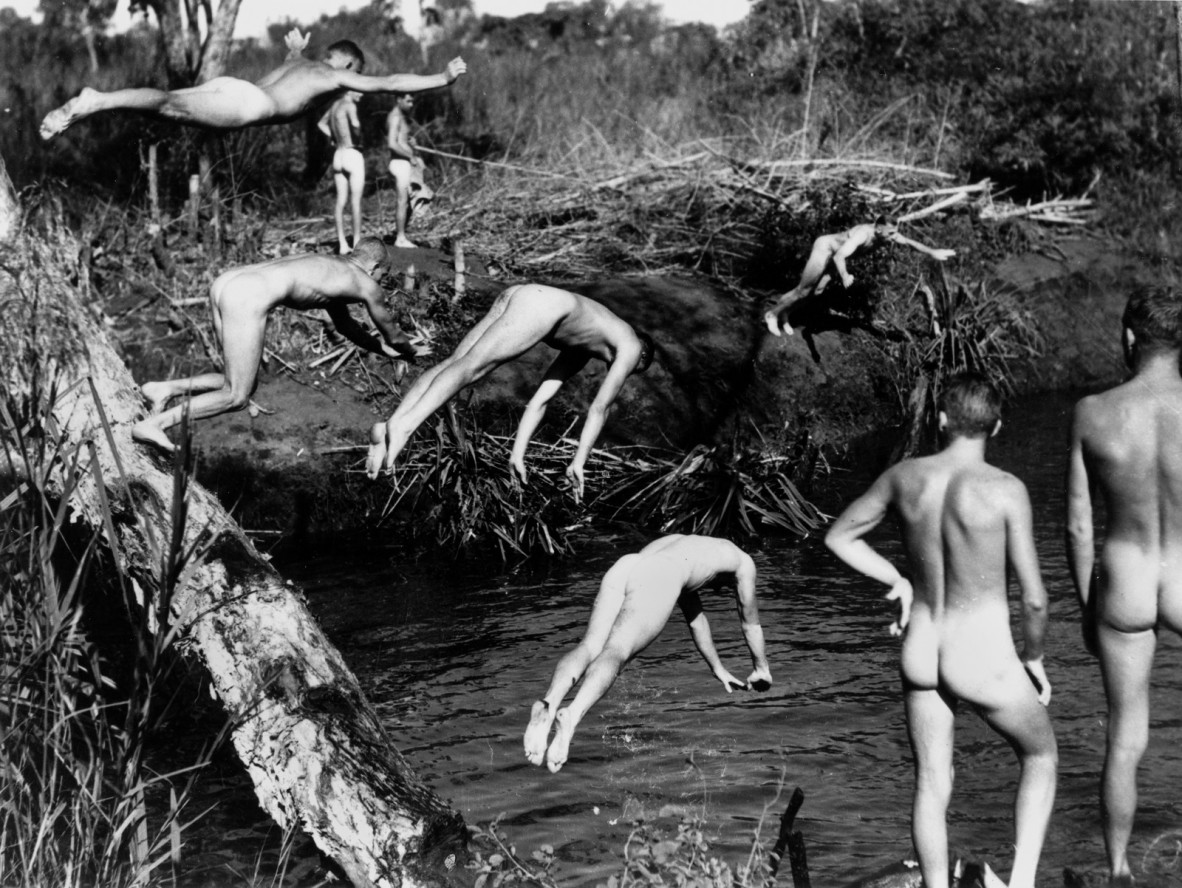 Naked servicemen swimming somewhere in the Darwin area during World War II