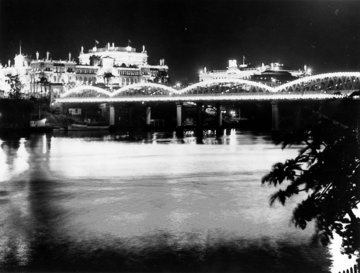 Victoria Bridge and Brisbane CBD buildings lit up for the Royal Visit in 1954