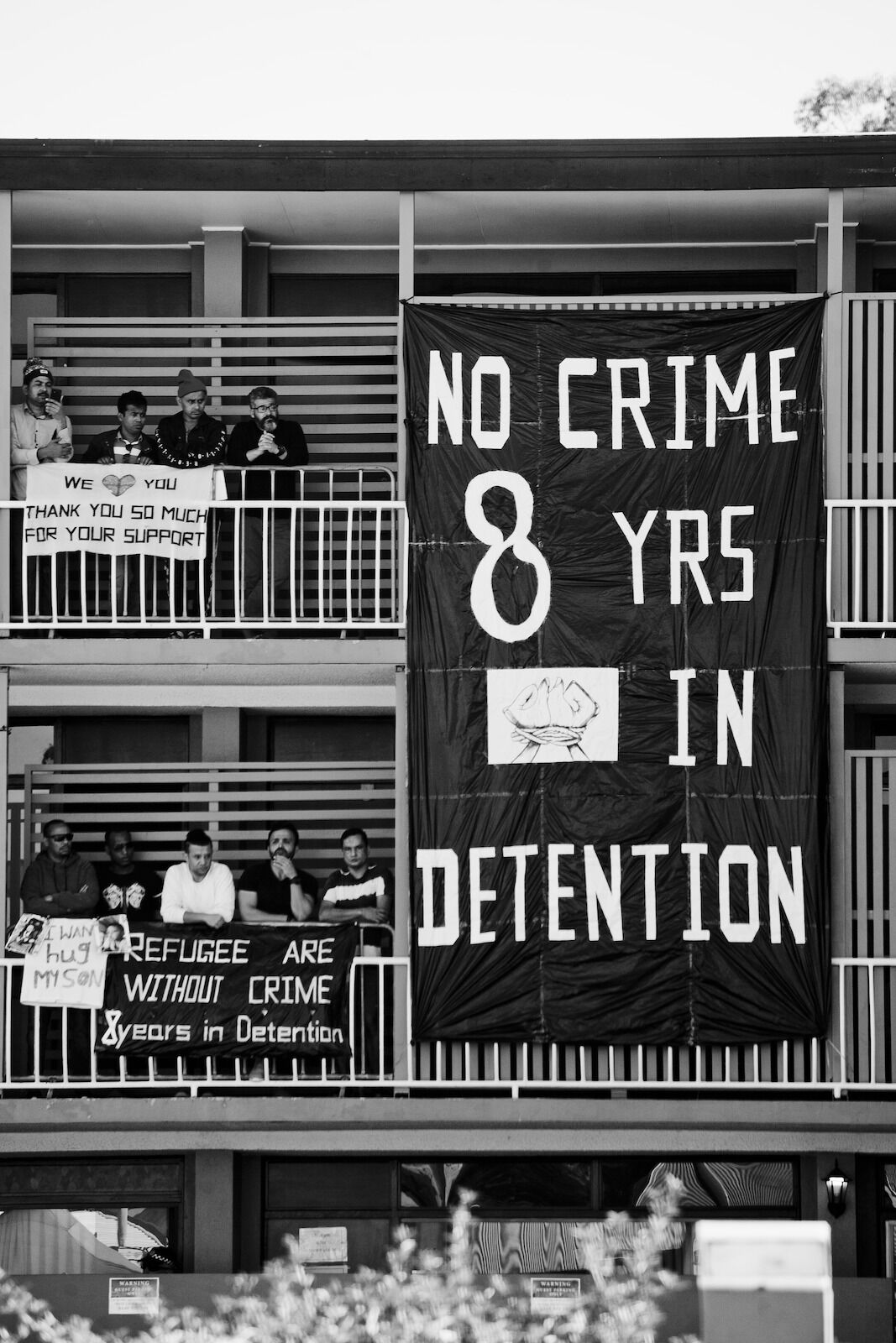 Banner on the balcony of the Kangaroo Point Central Hotel & Apartments protesting the detention of the asylum seekers detained there, Brisbane, 2020.