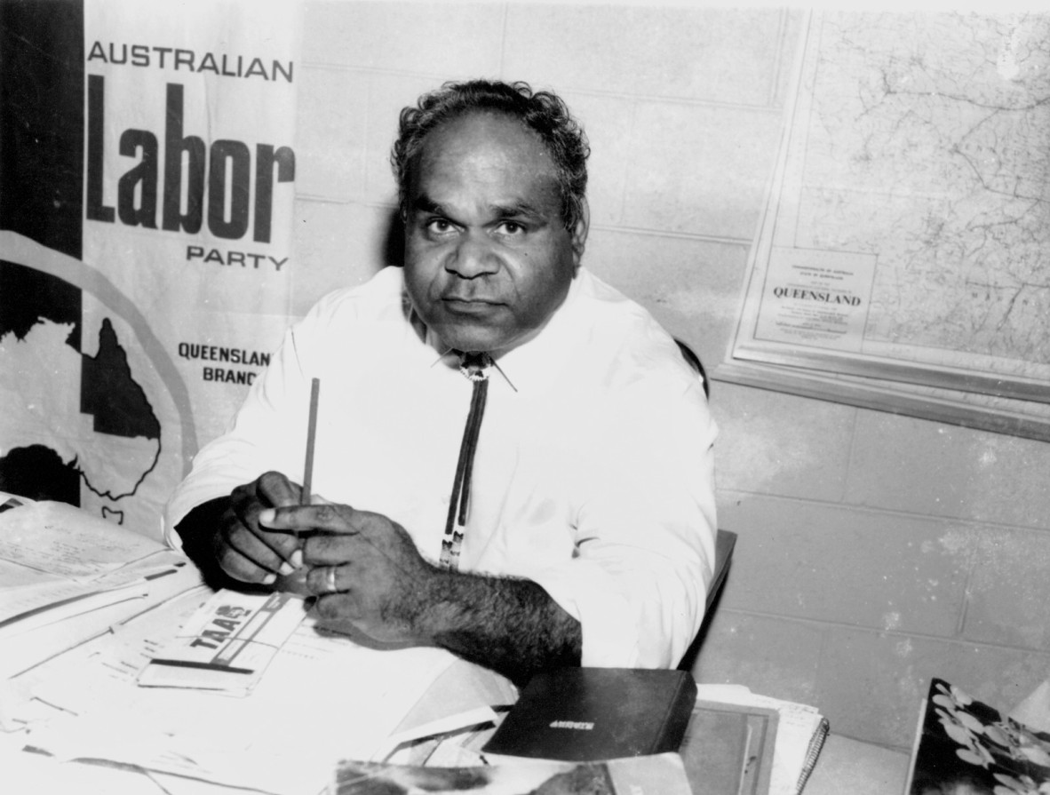 Pastor Don Brady sitting behind a desk at Palm Island 