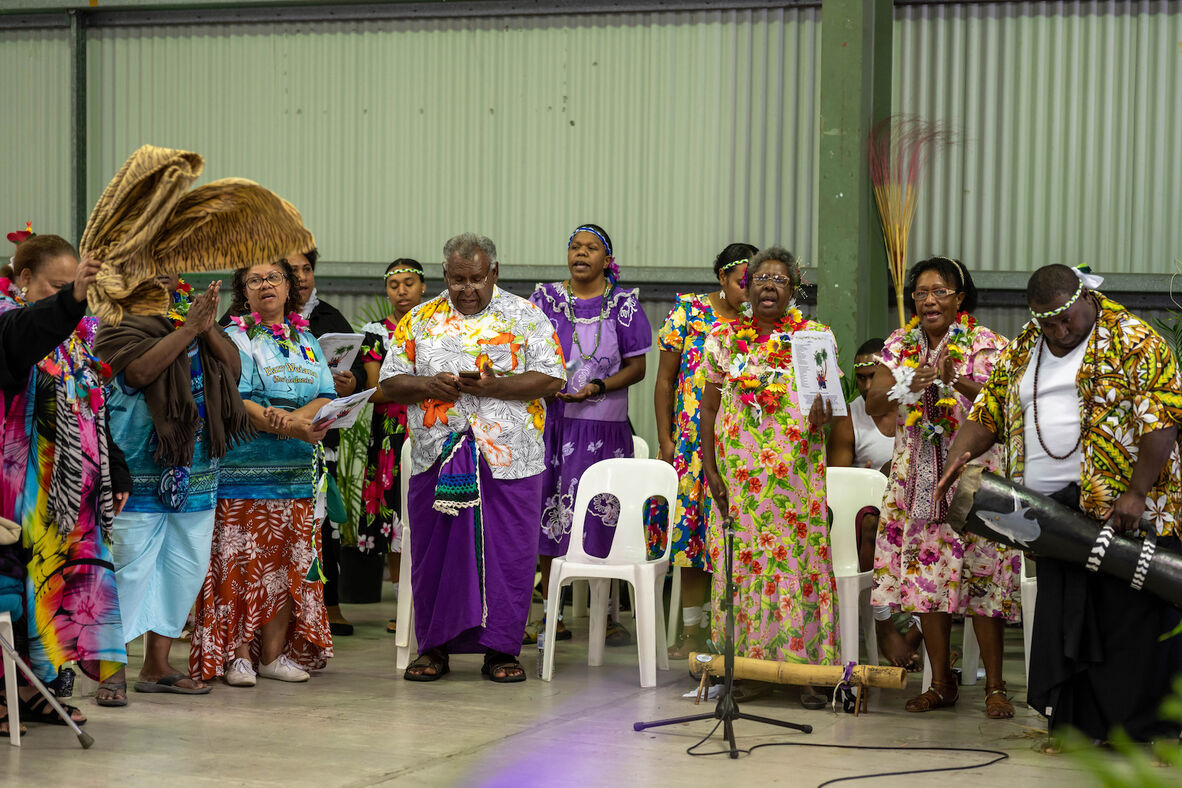 Group of men and women singing at the Coming of the Light Festival, Rockhampton, 2021.