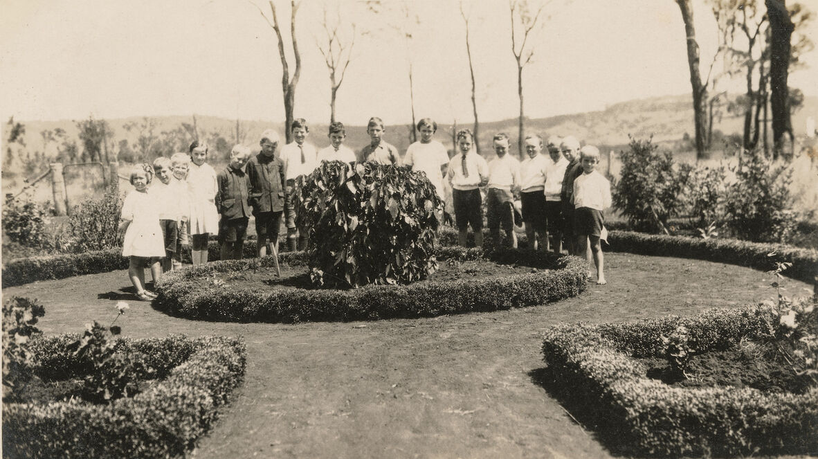 Students standing in the Norwood State School gardens, 1928.