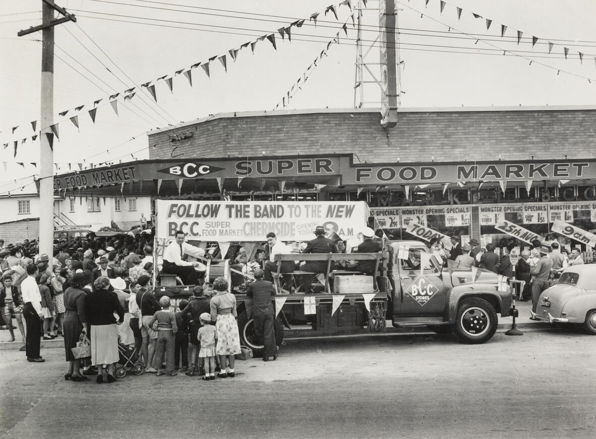 Band entertaining crowds outside the new Brisbane Cash and Carry store at Chermside, 1955
