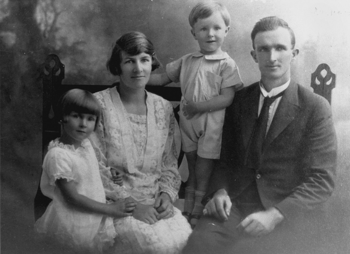 B&W family portrait of the Boyden family (L-R: daughter, mother, son, father)