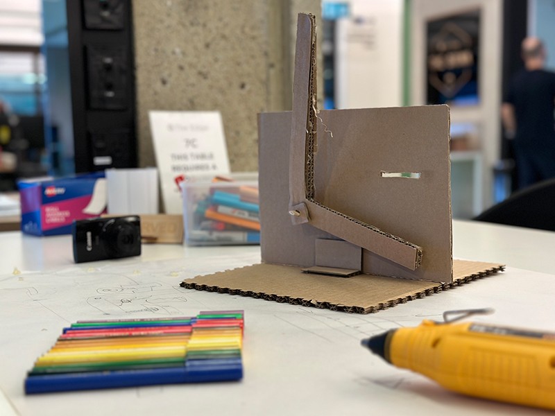 DIY Cardboard handle, texter and glue gun on table