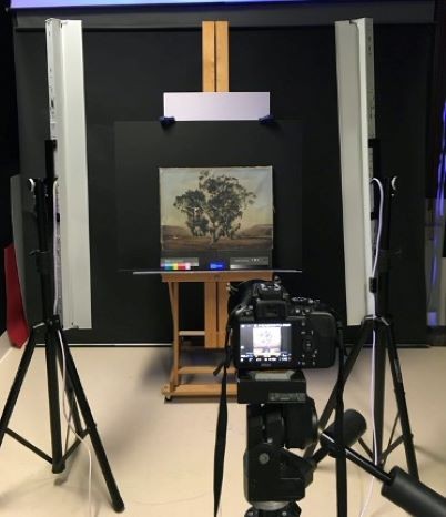 UVF photography set up including a full spectrum converted DSLR camera (centre) and UV light banks (left and right)