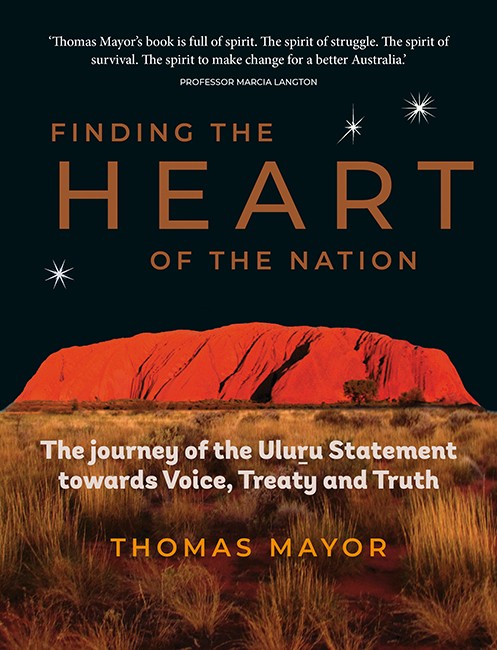 The cover of Finding the heart of the nation shows a photograph of Uluru red and in shadow with a foreground of grass