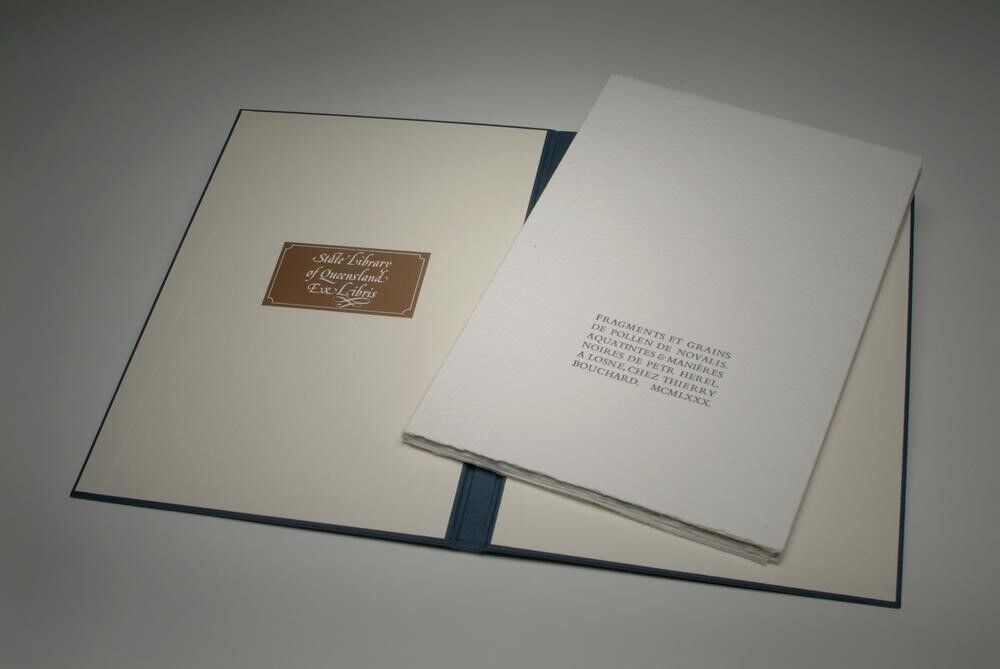 Loose pages in open slipcase.