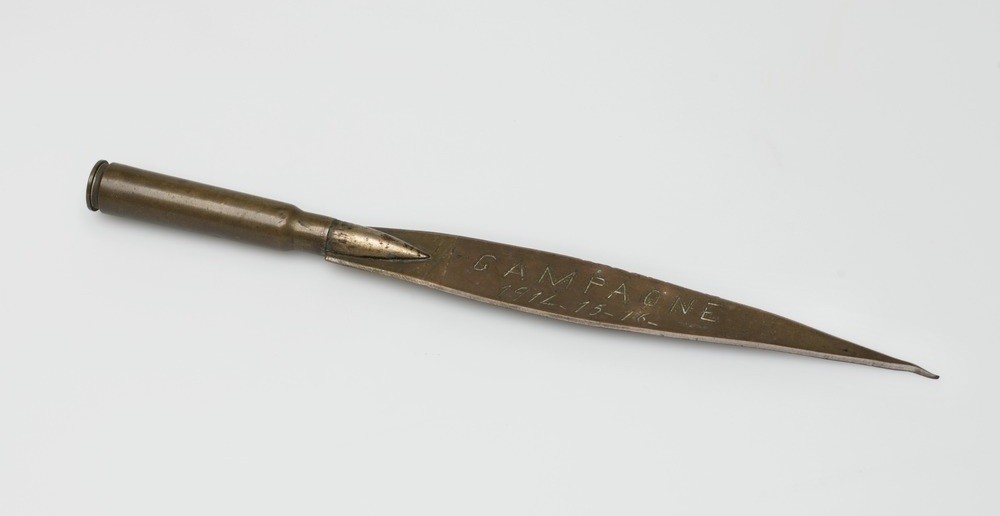 Etched and inscribed letter opener made from two bullets.