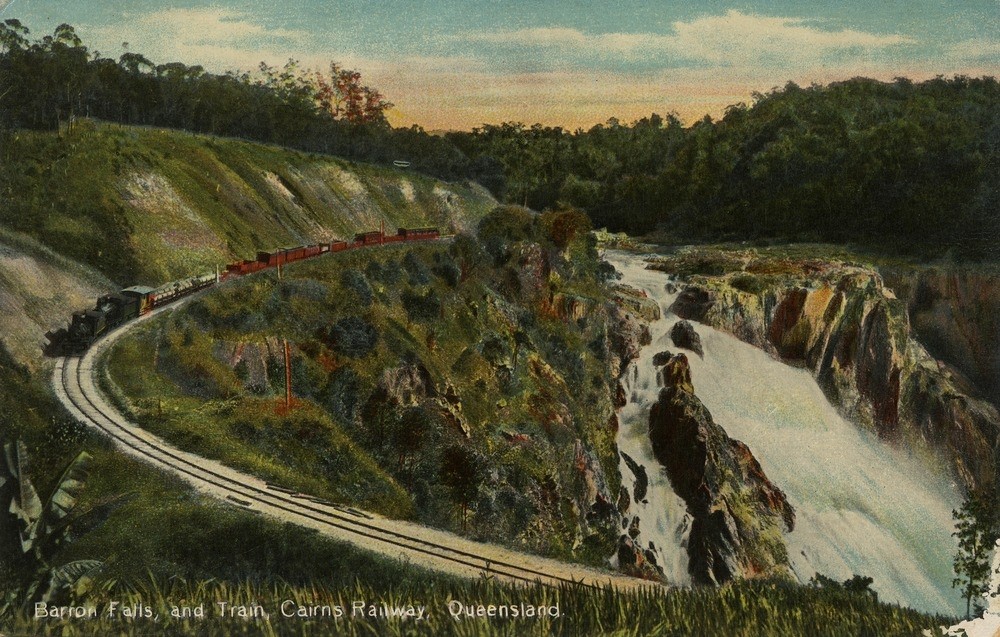 Freight train passing the Barron Falls , Atherton Tablelands, Queensland.