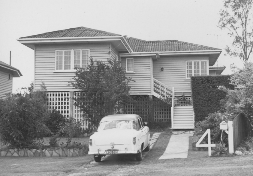 A house with a number 4 out the front and a car parked in the driveway