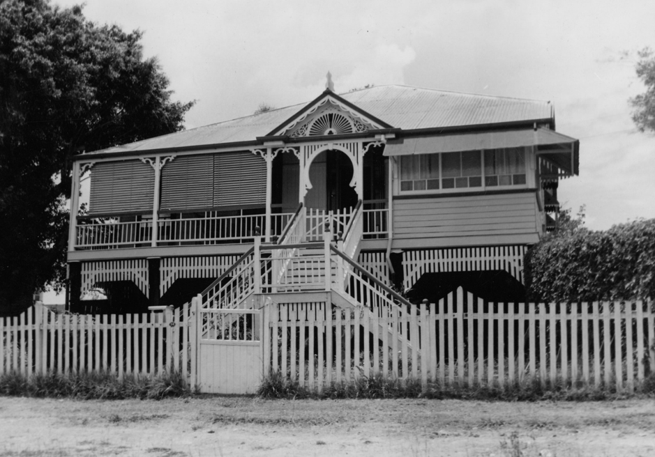Black and white photograph of a house with a wide verandah in Chermside