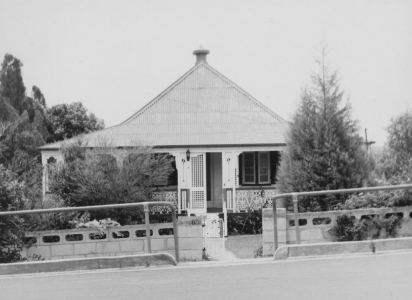 House with a pointed roof and fence in Newtown