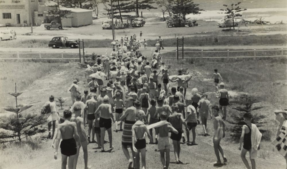 Large group of children going to the beach for an eleven o'clock swim