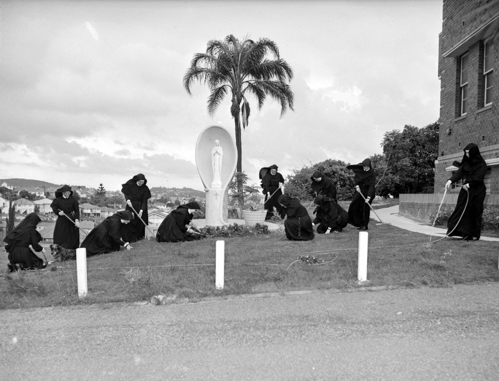 Sisters of Loreto gardening around a statue of Mary at Loreto College, Coorparoo, Brisbane