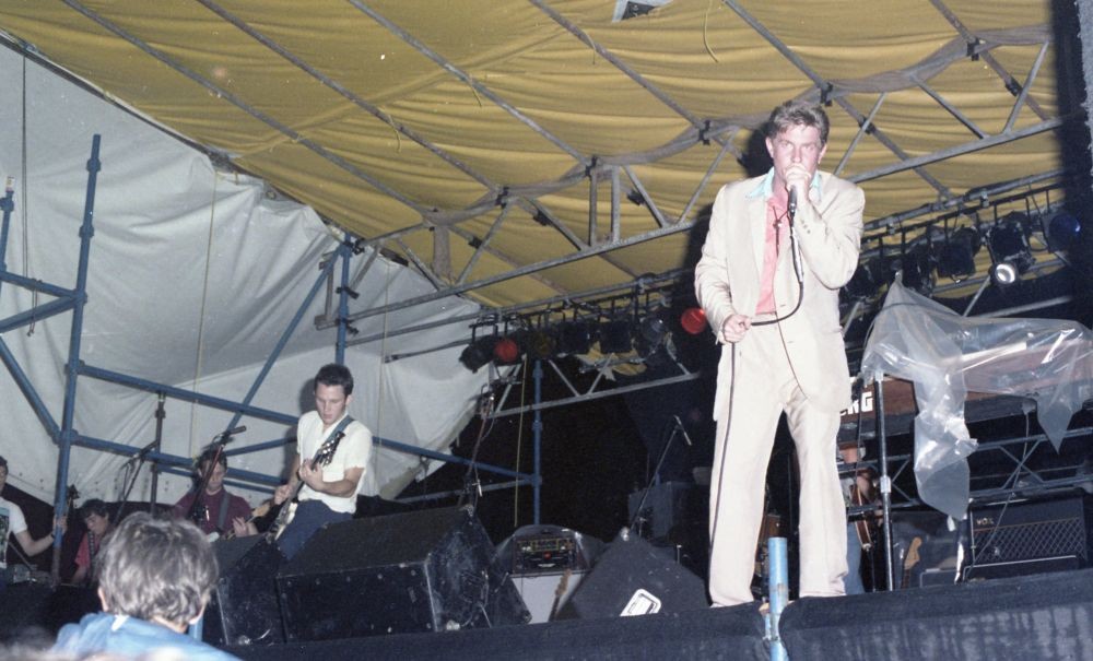 Greedy Smith performing with the band Mental as Anything on 9 January 1982 at the Noosa AFL grounds
