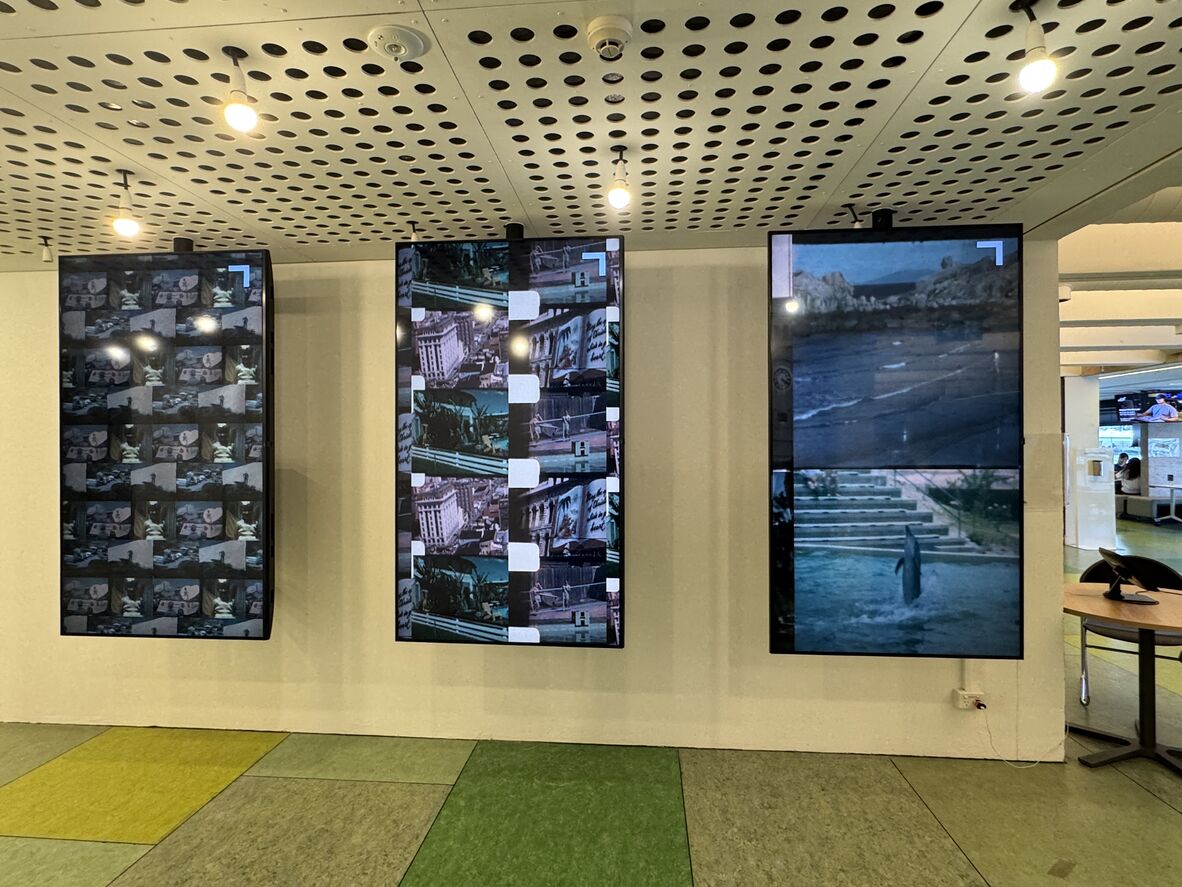 A photo of 3 digital screens
