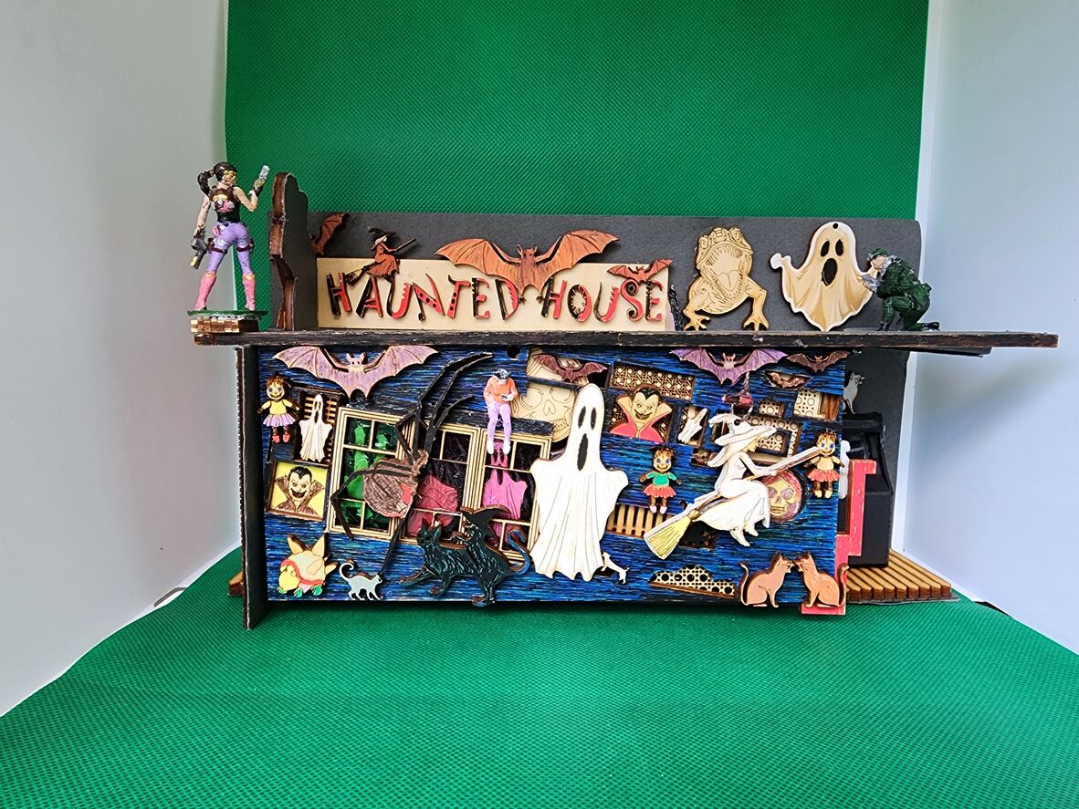 A photo of a miniature haunted house