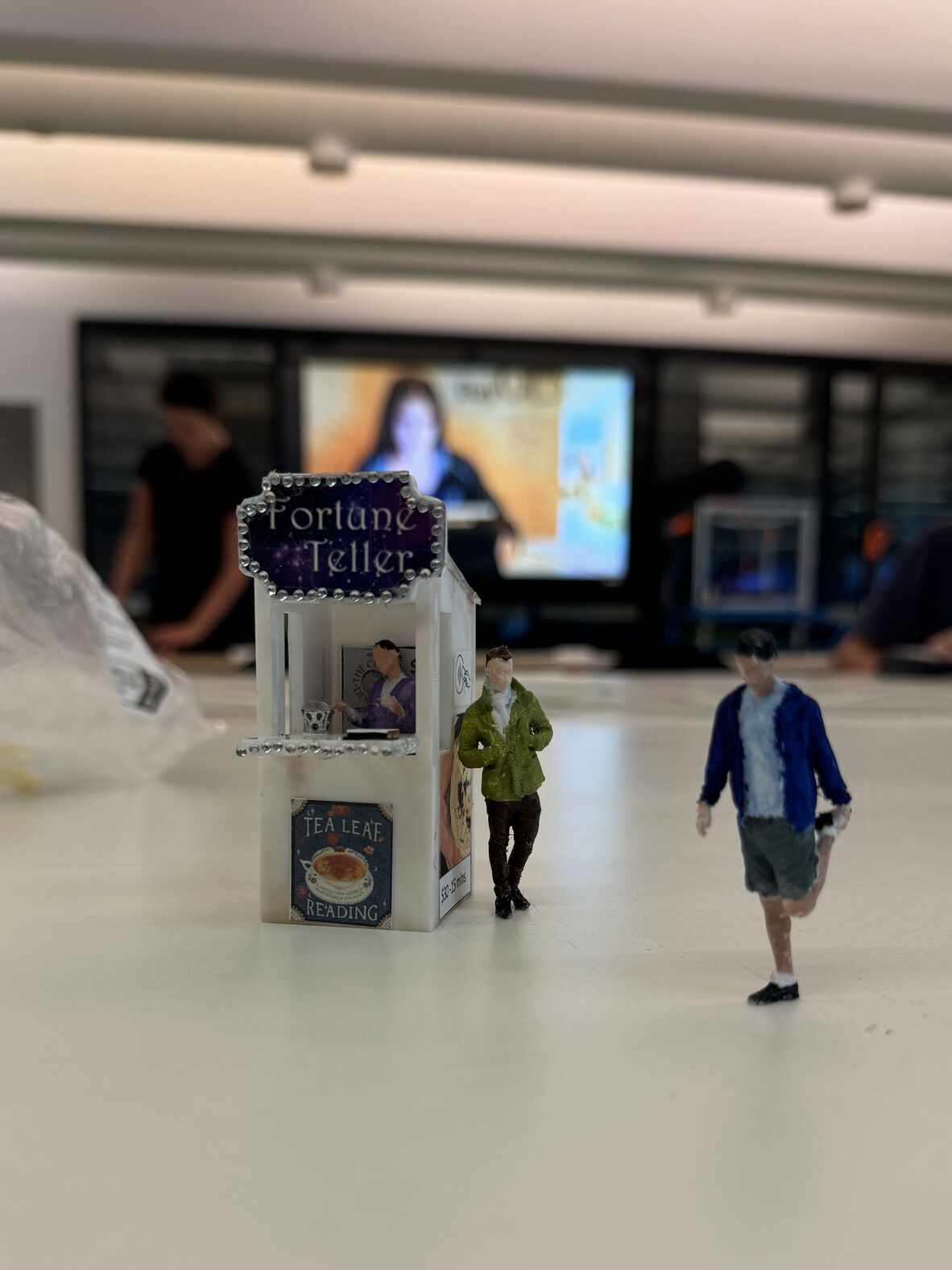 A photo of a miniature 3D printed fortune teller booth