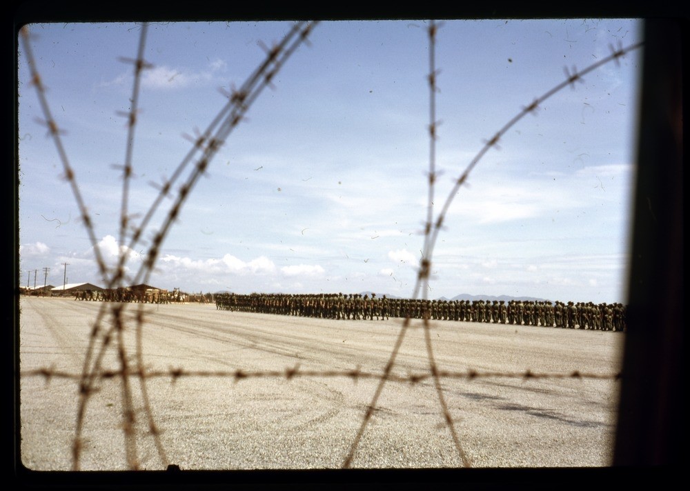 Photo of Australian troops in Vietnam, taken trough the barbwire.