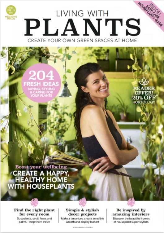 Image of front cover of Living with Plants magazine from Press Reader with woman standing side on surrounded by plants