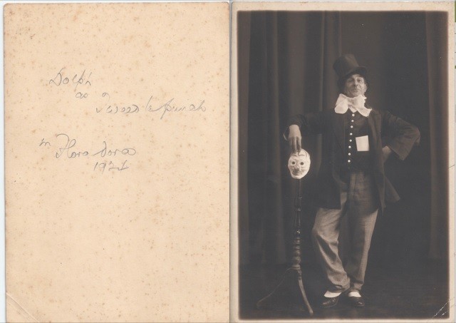An image of a man with a mask on a stick