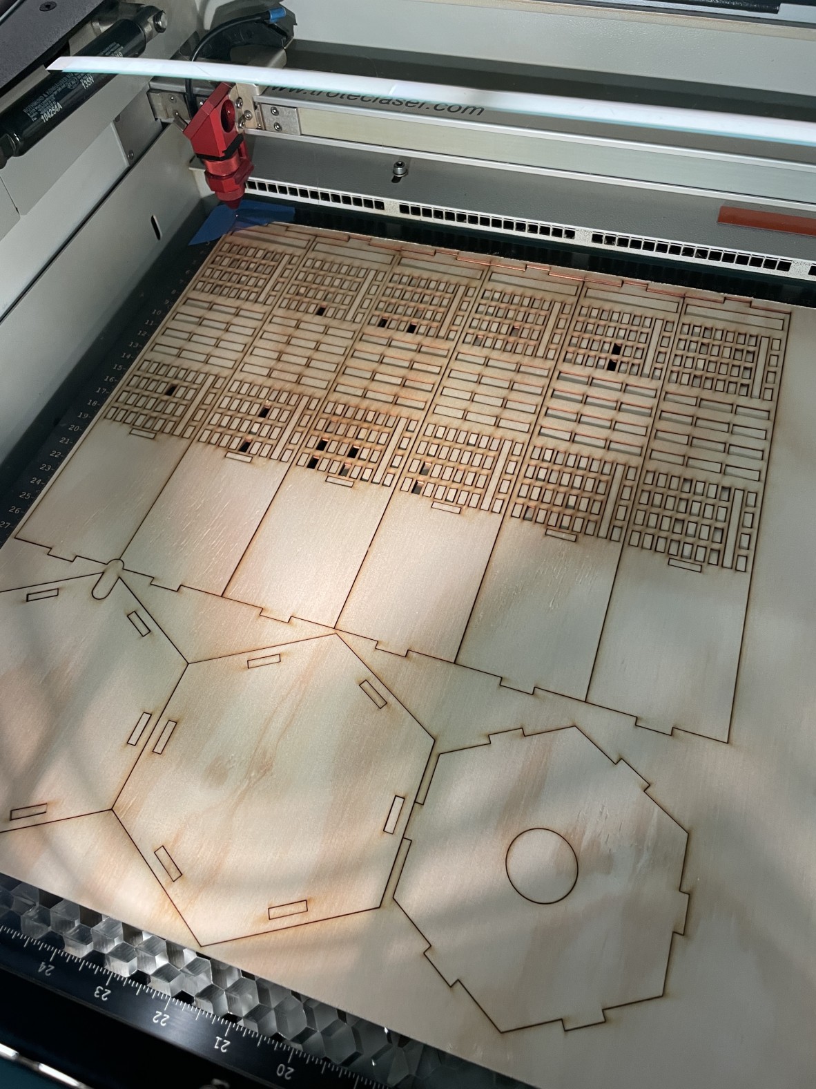 A photo of a lasered piece of ply wood