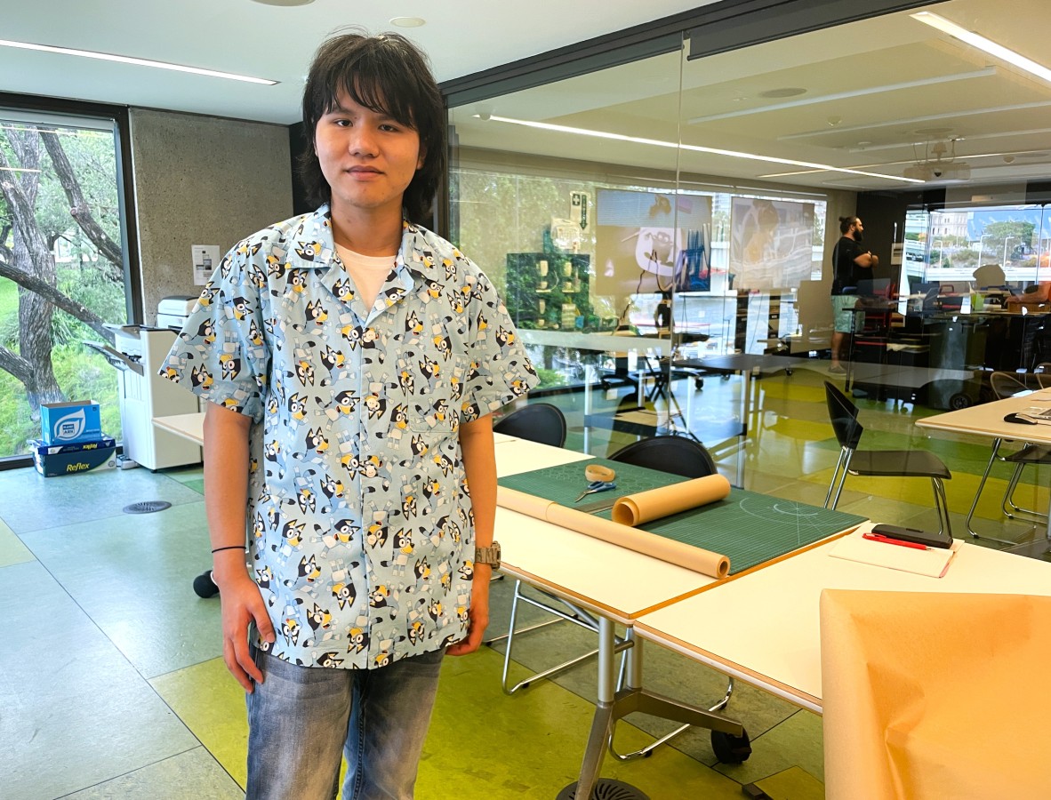 A photo of a young man in a shirt he has made