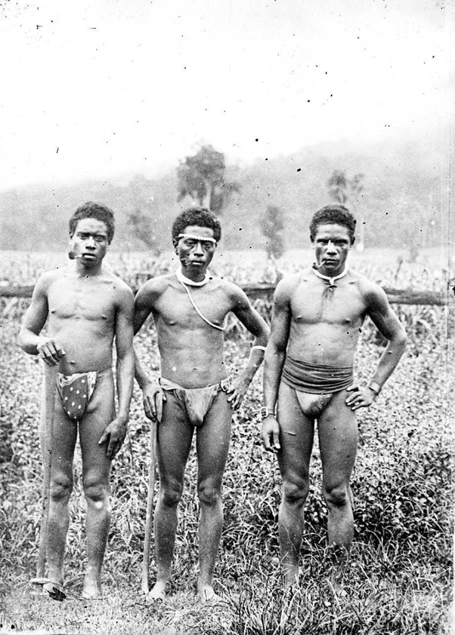 Photo of three male South Sea Islanders smoking pipes