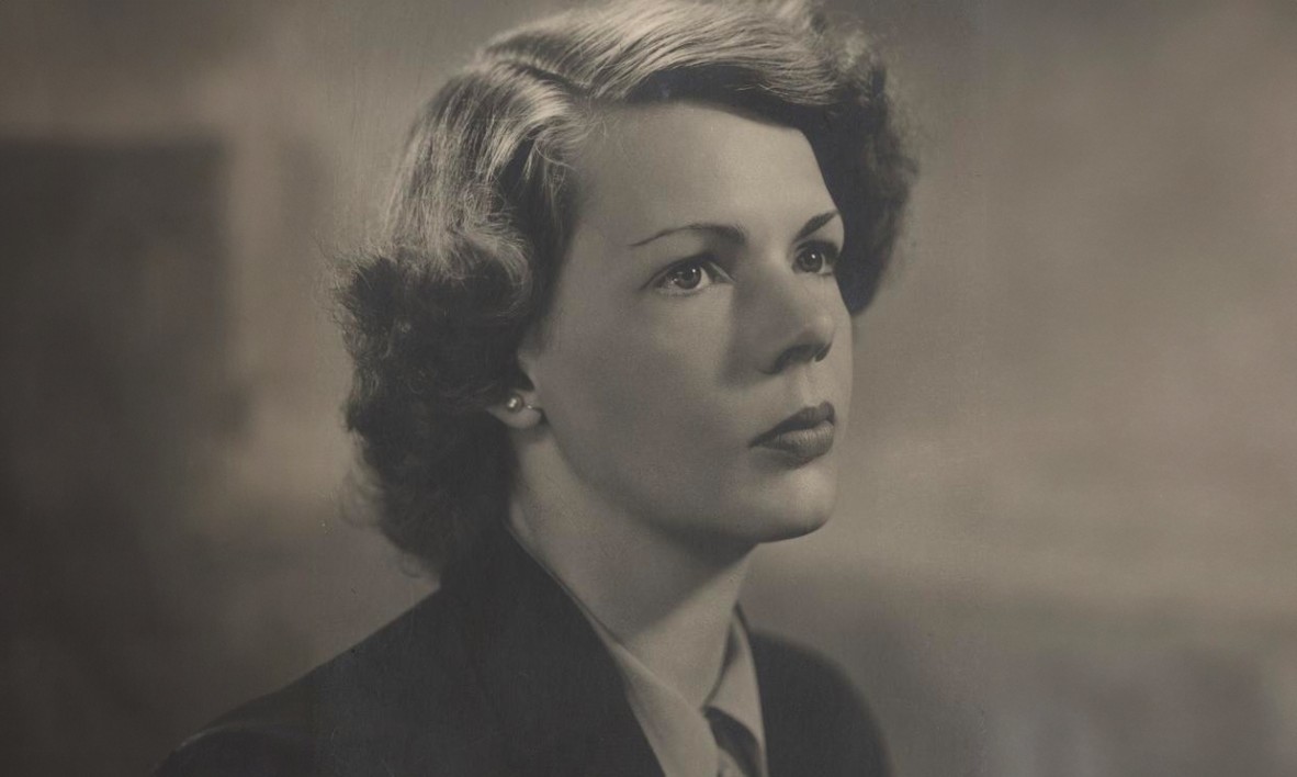 Black and white picture of a young woman in a suit jacket