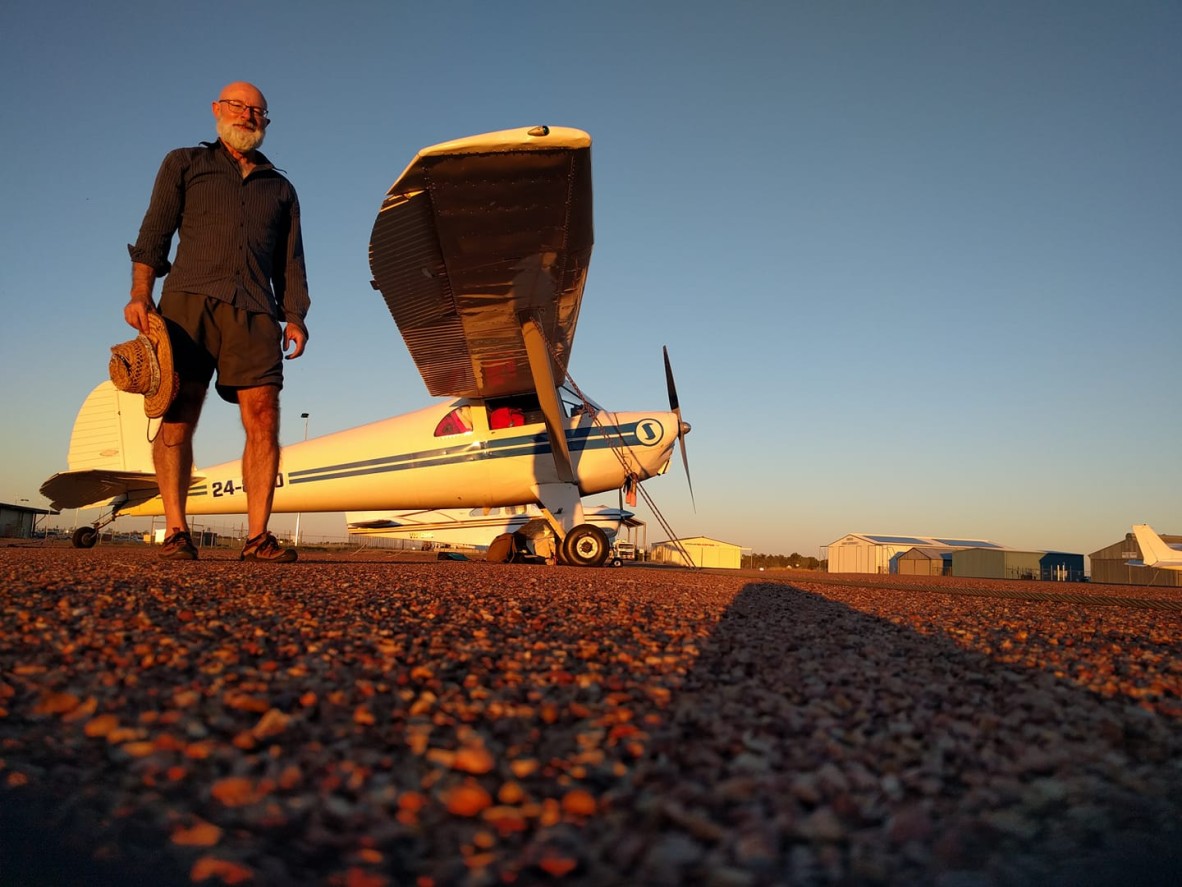 Mark Clayton and his 1930s-era Luscombe Silvaire, coloured by a Longreach sunset.