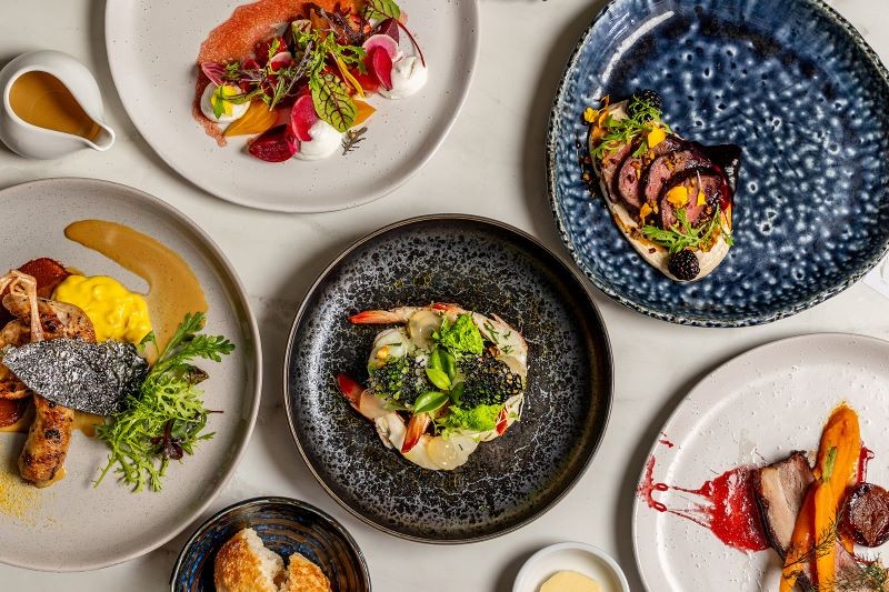Plates of food on various dishes