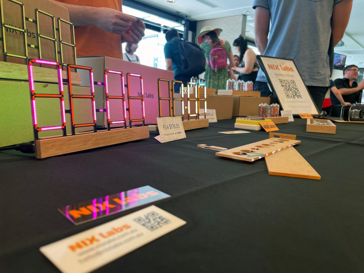a close up shot of a market stall showing off some laser cut clocks