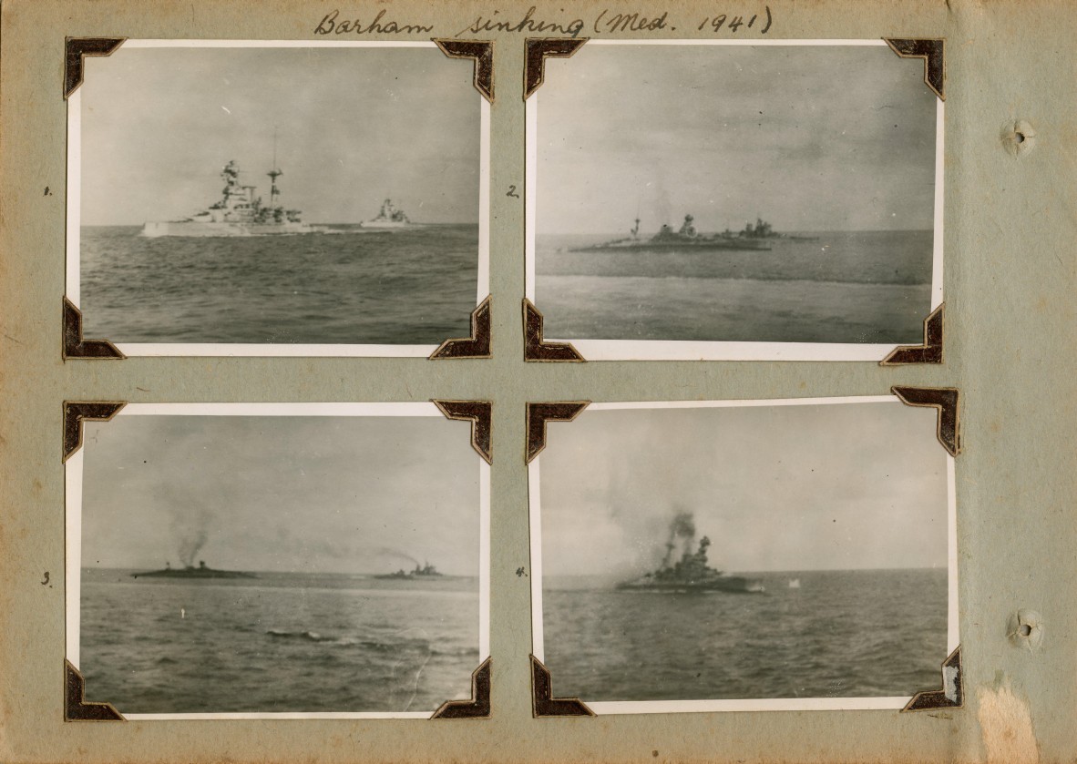 The battleship HMS Barham begins to list after being hit by three torpedos