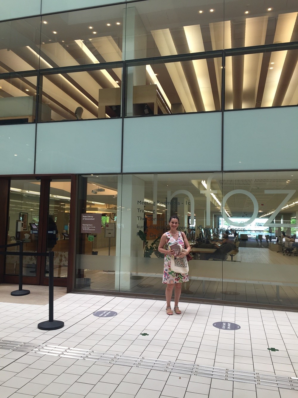 Mirandi returning her books to the Infozone at State Library