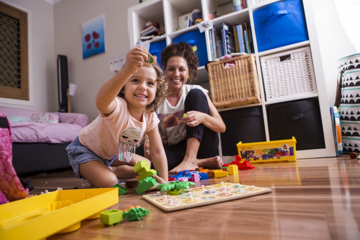 Mother and preschooler playing games