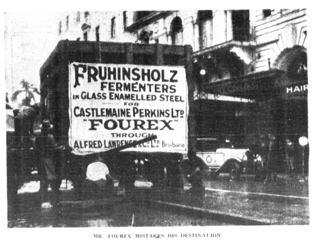 Newspaper image of a truck carrying a steel vat broken down on a Brisbane street. A caption reads: 'MR. FOUREX MISTAKES HIS DESTINATION'