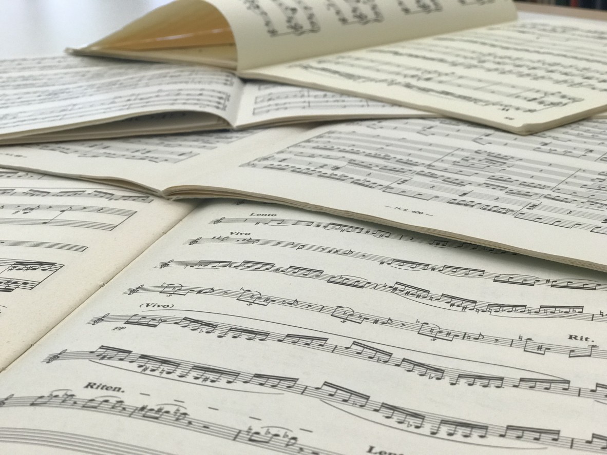 Music sheets open on a table