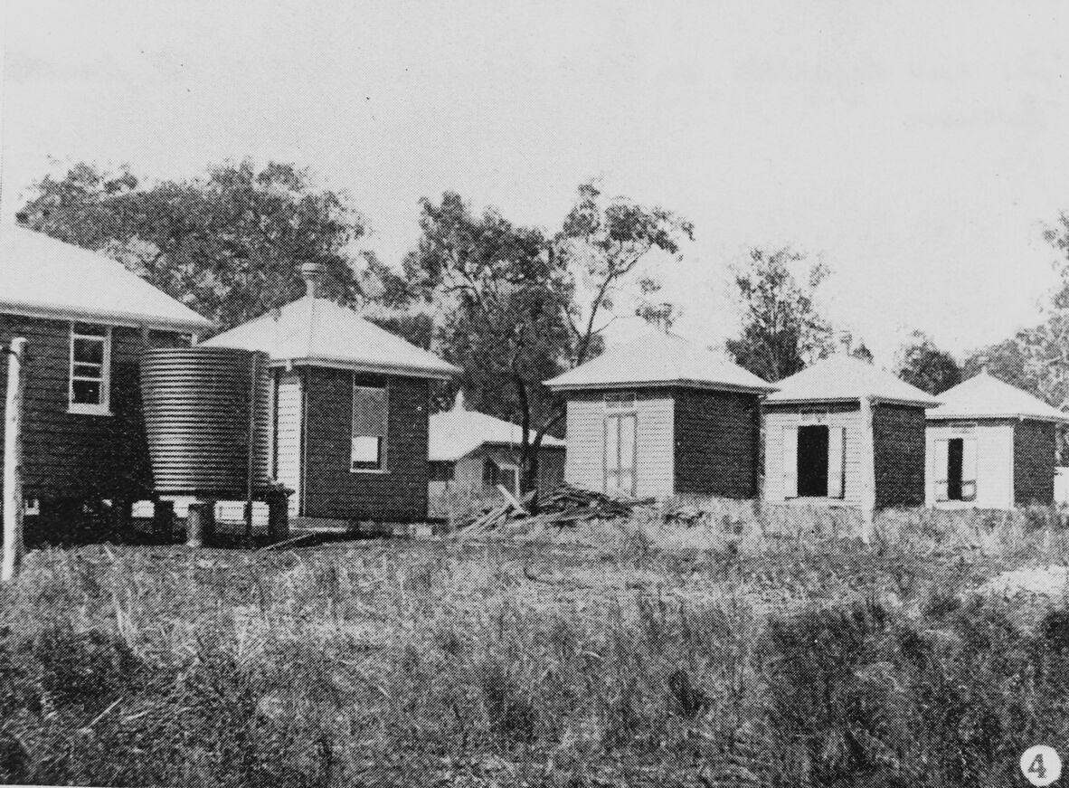 Black and white photo of lazarette huts on Peel Island