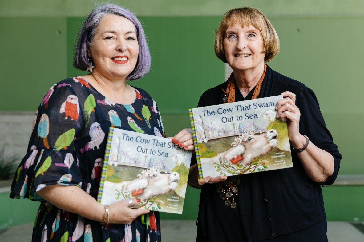 Illustrator Nicola Hooper and author Pamela Rushby holding their book